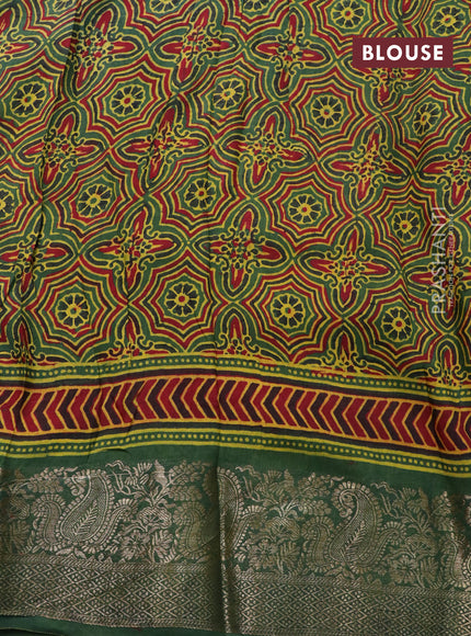 Dola silk saree green and red with allover ajrakh prints and zari woven border