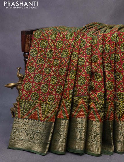 Dola silk saree green and red with allover ajrakh prints and zari woven border