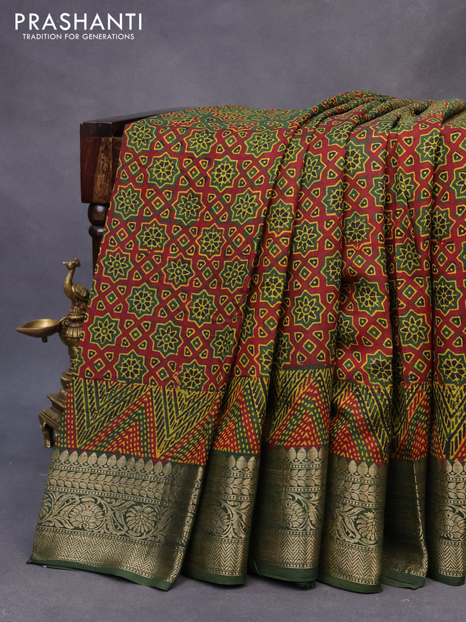 Dola silk saree green and red with allover ajrakh prints and zari woven border