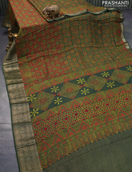 Dola silk saree green and red with allover ajrakh prints and zari woven border