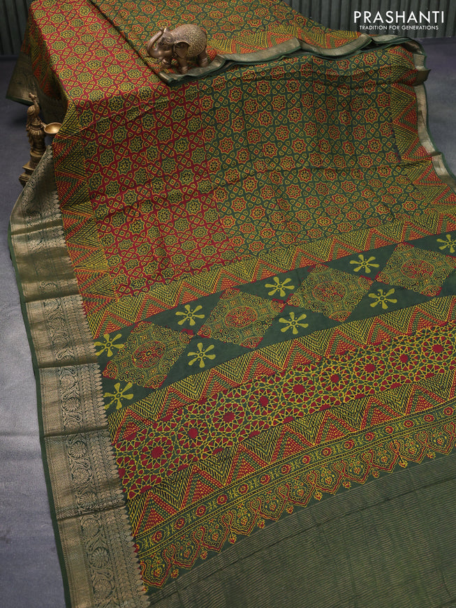 Dola silk saree green and red with allover ajrakh prints and zari woven border