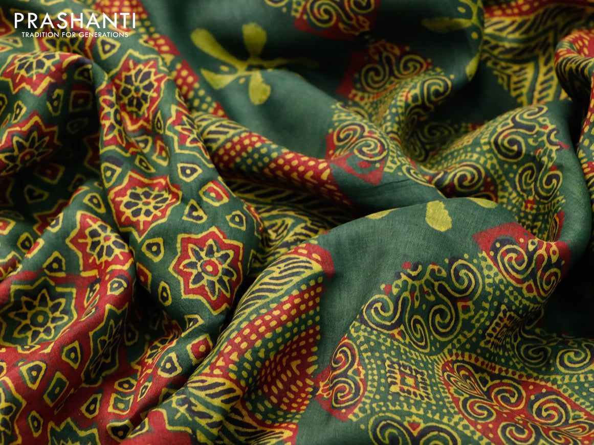 Dola silk saree green and red with allover ajrakh prints and zari woven border