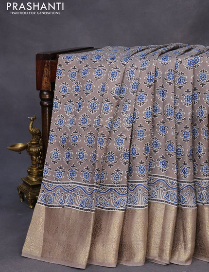 Dola silk saree grey with allover ajrakh prints and zari woven border