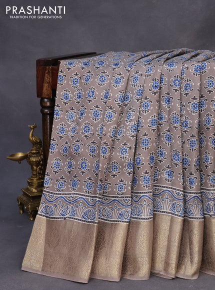 Dola silk saree grey with allover ajrakh prints and zari woven border