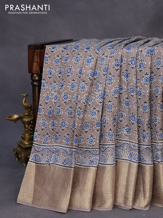 Dola silk saree grey with allover ajrakh prints and zari woven border