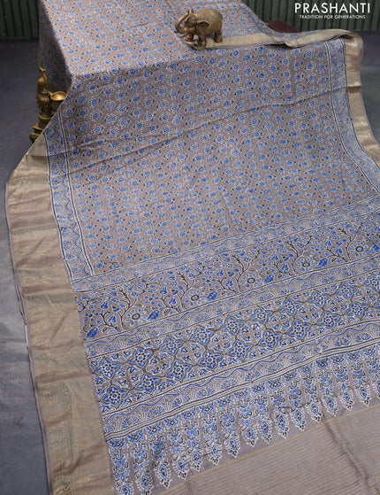 Dola silk saree grey with allover ajrakh prints and zari woven border