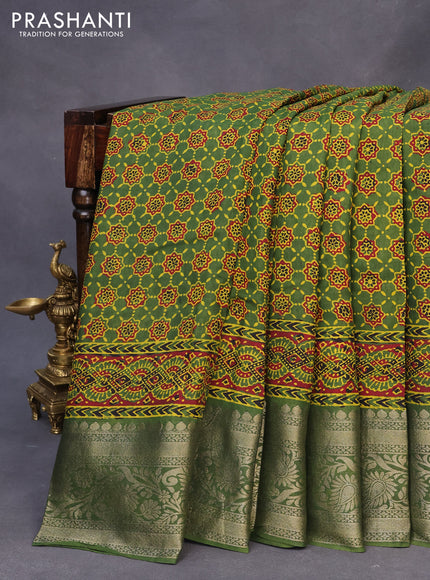 Dola silk saree green and red with allover ajrakh prints and zari woven border