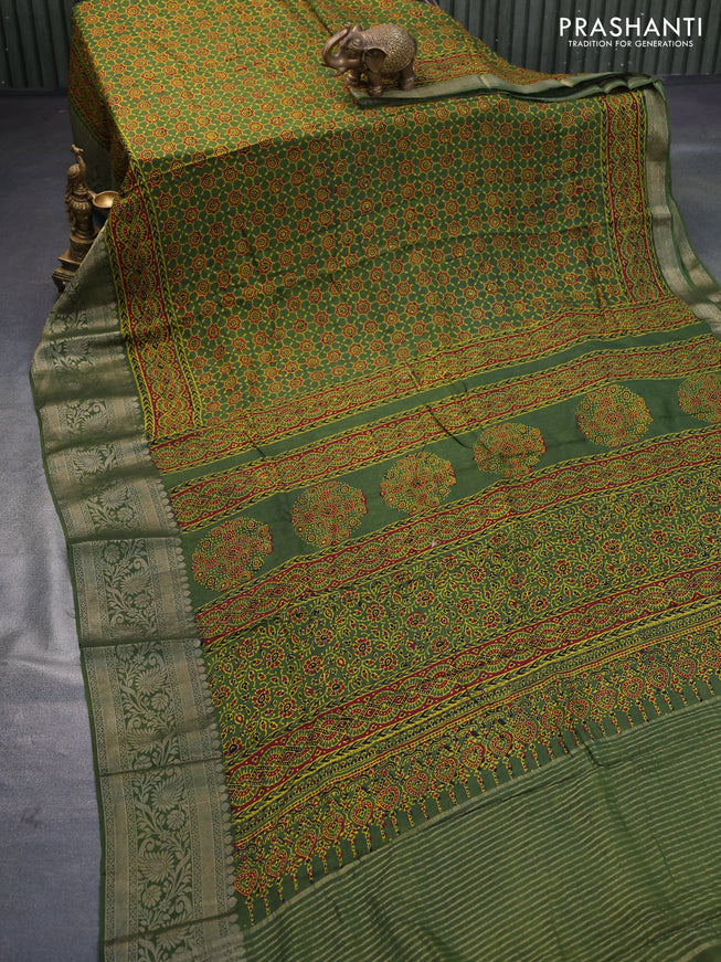 Dola silk saree green and red with allover ajrakh prints and zari woven border