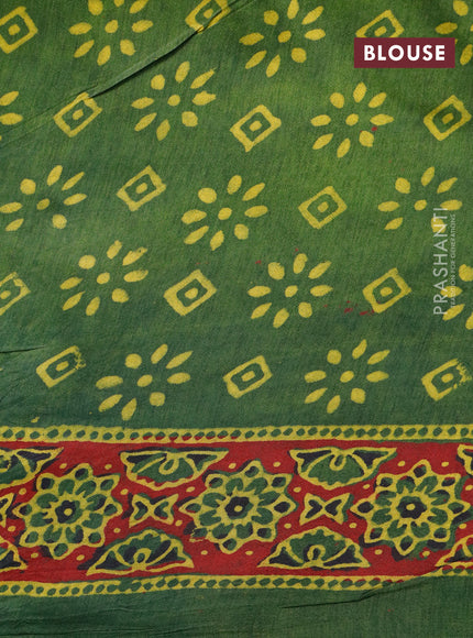 Dola silk saree green and red with allover ajrakh prints and zari woven border