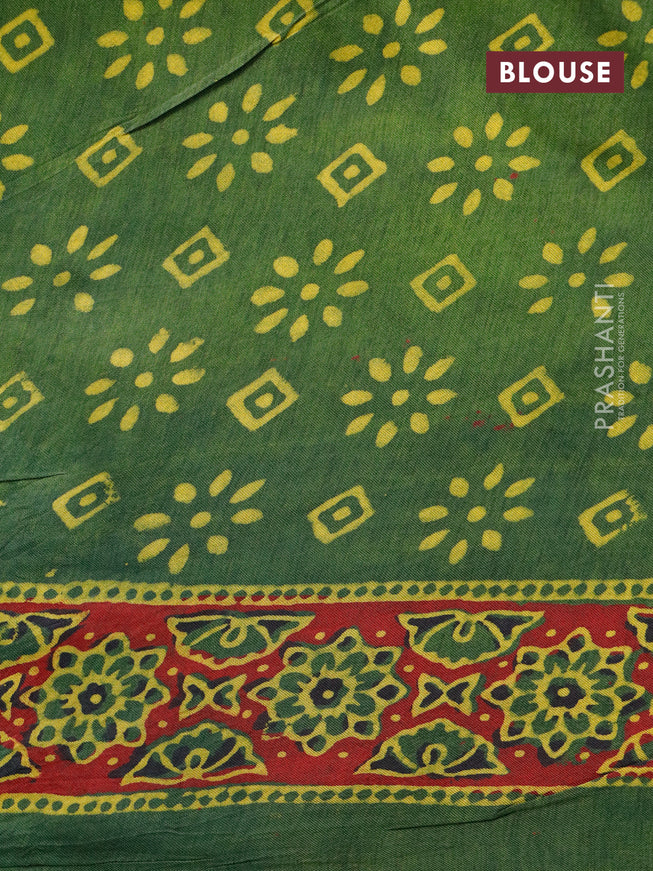 Dola silk saree green and red with allover ajrakh prints and zari woven border