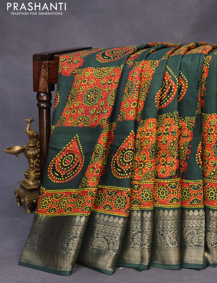 Dola silk saree green and red with allover ajrakh prints and zari woven border