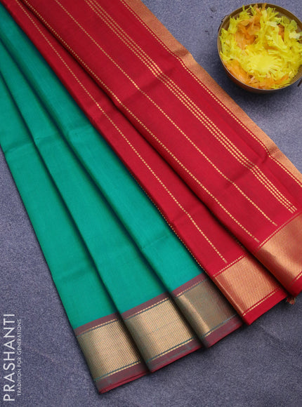 Silk cotton saree teal green and red with plain body and small zari woven border