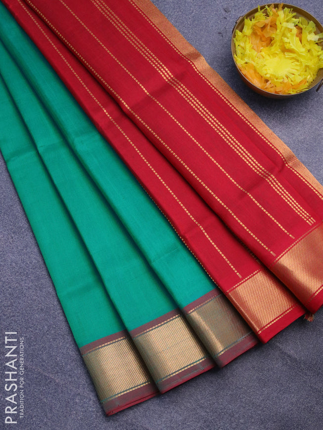 Silk cotton saree teal green and red with plain body and small zari woven border