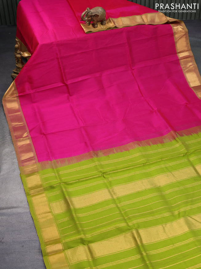 Silk cotton saree pink and light green with plain body and zari woven border