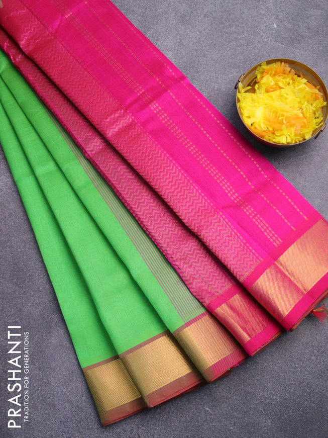 Silk cotton saree green and pink with plain body and zari woven border