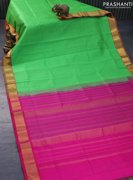 Silk cotton saree green and pink with plain body and zari woven border