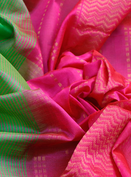 Silk cotton saree green and pink with plain body and zari woven border