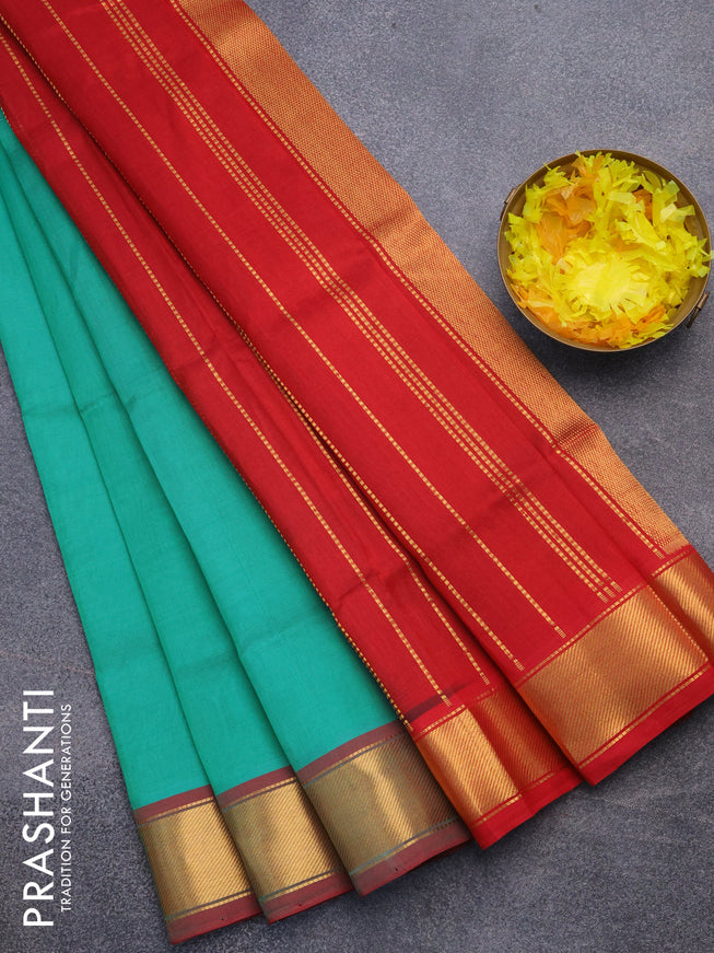 Silk cotton saree teal green and red with plain body and zari woven border