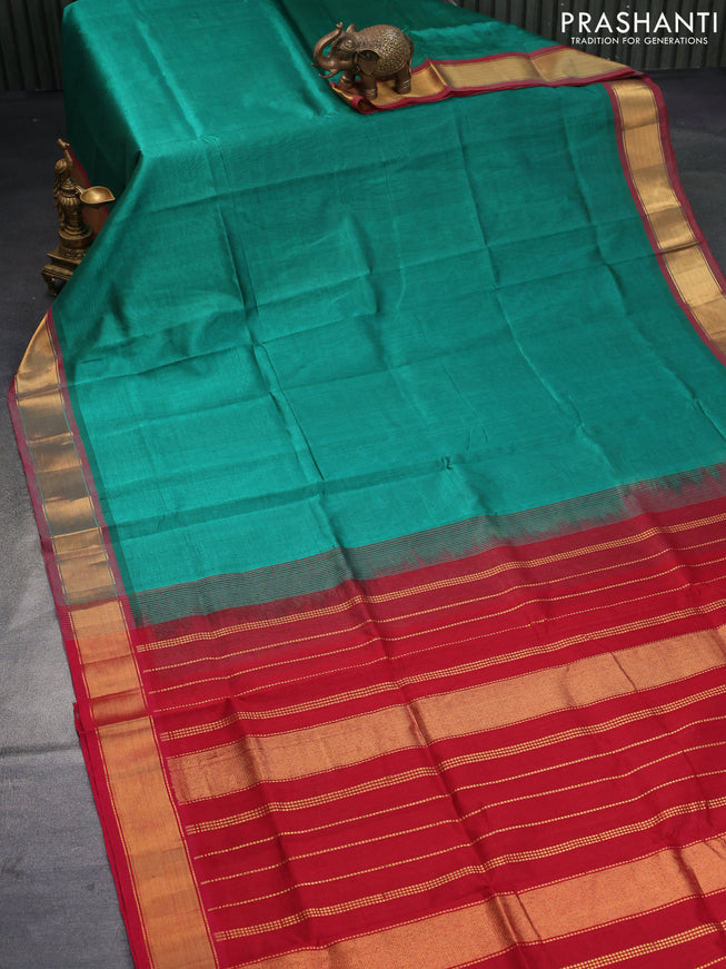 Silk cotton saree green shade and red with plain body and zari woven border