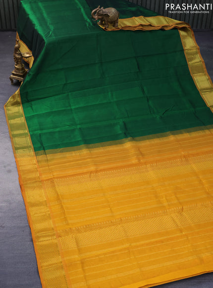 Silk cotton saree green and mustard yellow with plain body and zari woven border