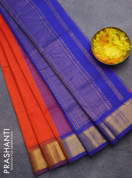 Silk cotton saree orange and blue with plain body and zari woven border