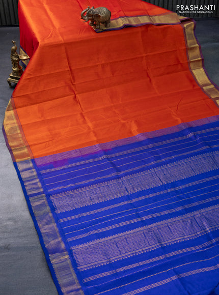 Silk cotton saree orange and blue with plain body and zari woven border