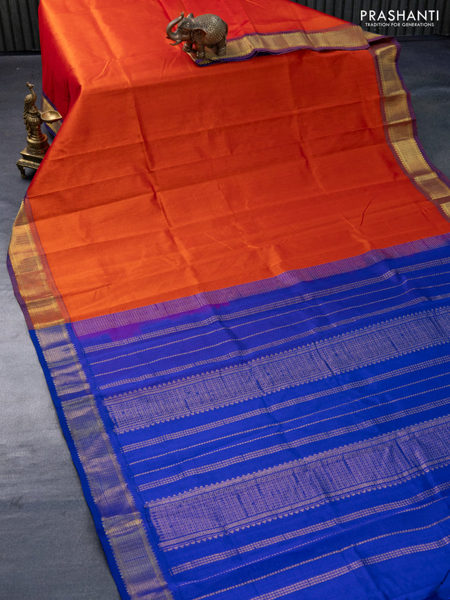 Silk cotton saree orange and blue with plain body and zari woven border