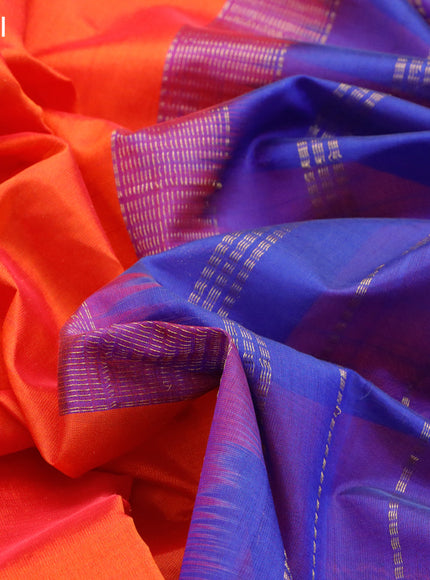 Silk cotton saree orange and blue with plain body and zari woven border