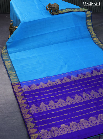 Silk cotton saree light blue and blue with plain body and temple design zari woven border