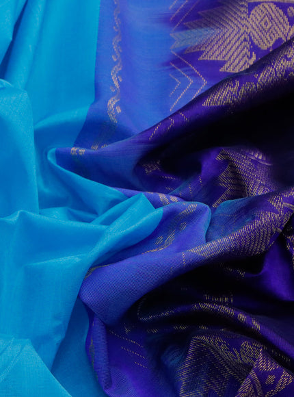 Silk cotton saree light blue and blue with plain body and temple design zari woven border