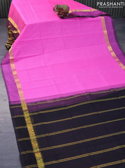 Silk cotton saree pink and black with plain body and zari woven simple border