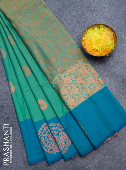 Semi soft silk saree dual shade of green and dual shade of bluish green with copper zari woven buttas and zari woven butta border