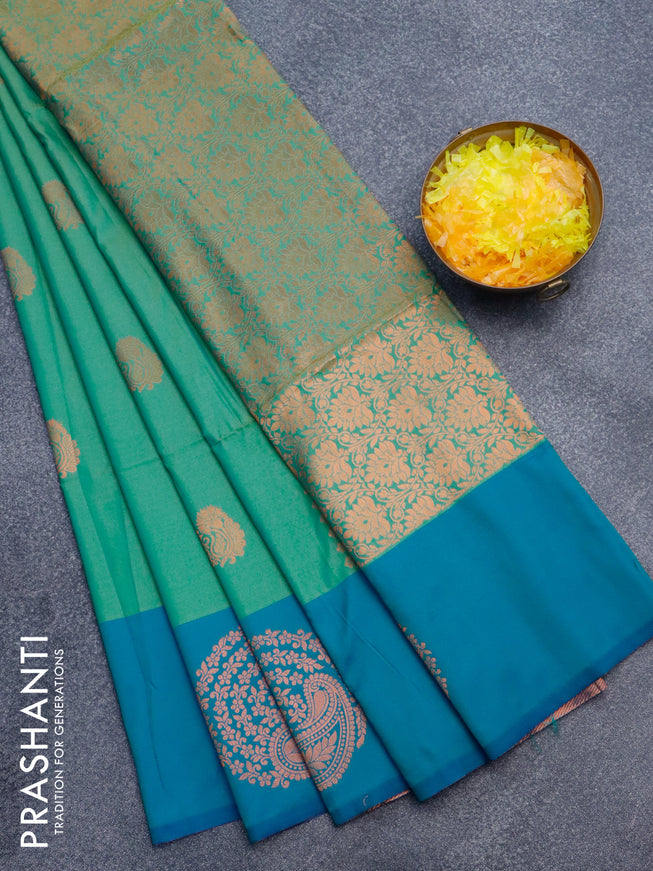 Semi soft silk saree dual shade of green and dual shade of bluish green with copper zari woven buttas and zari woven butta border