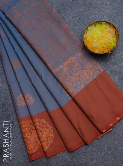 Semi soft silk saree dual shade of blue and dual shade of rust with copper zari woven buttas and zari woven butta border