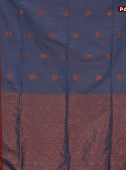 Semi soft silk saree dual shade of blue and dual shade of rust with copper zari woven buttas and zari woven butta border