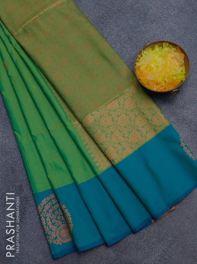 Semi soft silk saree light green and dual shade of green with copper zari woven buttas and zari woven butta border