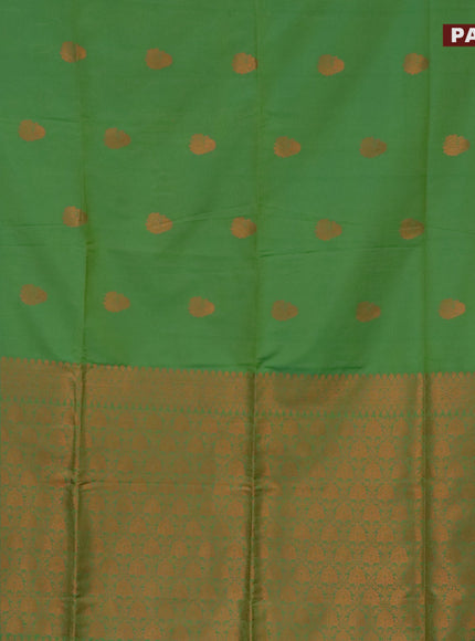 Semi soft silk saree light green and dual shade of green with copper zari woven buttas and zari woven butta border