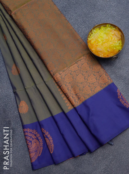 Semi soft silk saree dual shade of sap green and blue with copper zari woven buttas and zari woven butta border