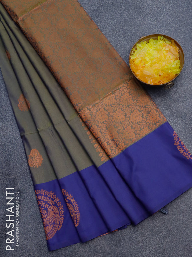 Semi soft silk saree dual shade of sap green and blue with copper zari woven buttas and zari woven butta border