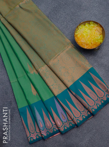 Semi soft silk saree dual shade of green and dual shade of blue with copper zari woven buttas and zari woven border