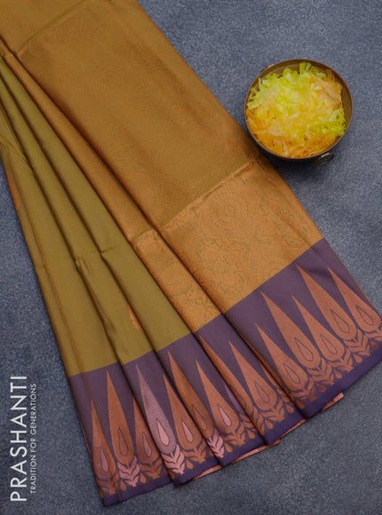 Semi soft silk saree mustard green shade and violet with copper zari woven buttas and zari woven border