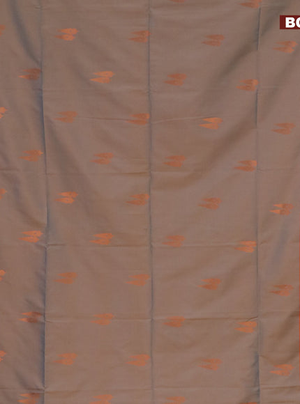 Semi soft silk saree dual shade of bluish beige and rustic orange with copper zari woven buttas and zari woven border