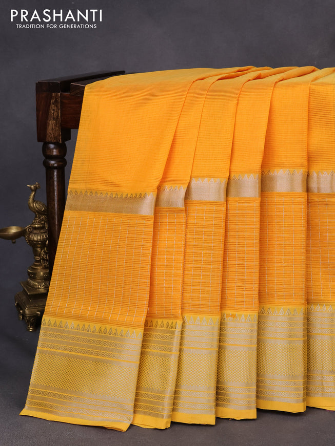 Mangalgiri silk cotton saree mango yellow with plain body and silver zari woven border