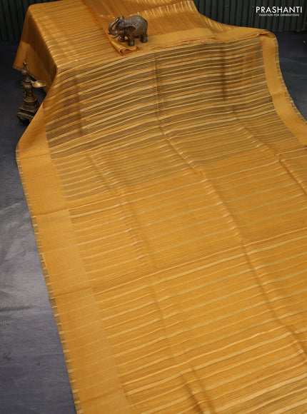 Organza saree mustard yellow with allover zari weaves and simple border