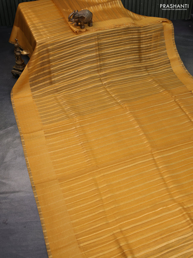 Organza saree mustard yellow with allover zari weaves and simple border