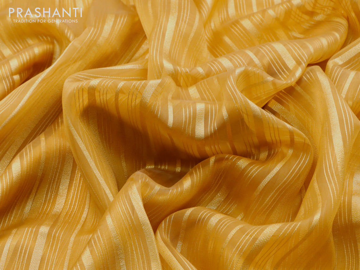 Organza saree mustard yellow with allover zari weaves and simple border