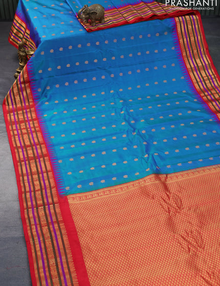 Pure gadwal silk saree dual shade of teal bluish green and red with zari woven buttas and temple design zari border