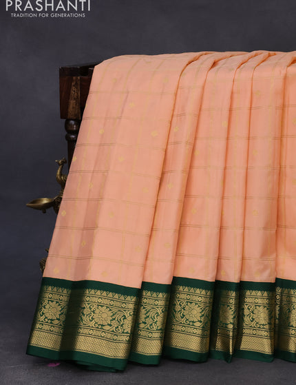 Pure gadwal silk saree pastel peach and green with allover zari checked pattern & zari buttas and zari woven border