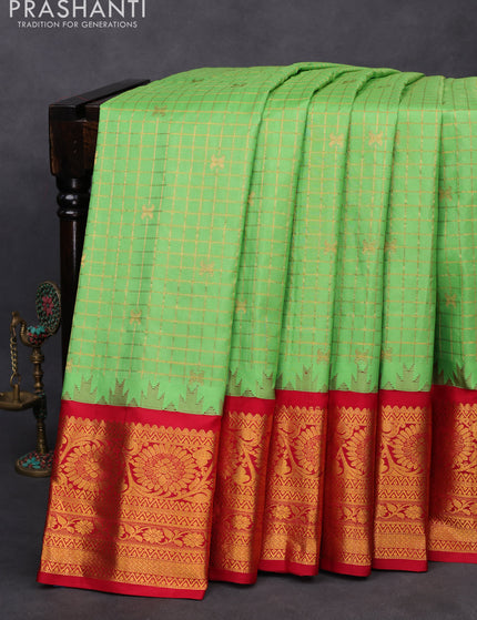 Pure gadwal silk saree pastel green and red with allover zari woven checked pattern and temple design floral zari woven border