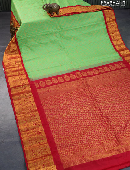 Pure gadwal silk saree pastel green and red with allover zari woven checked pattern and temple design floral zari woven border